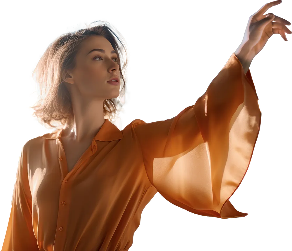 A girl wearing an orange dress reaching out into the air to touch something that is not there